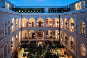 an inside view of a building with a courtyard at The Jaffa, a Luxury Collection Hotel, Tel Aviv in Tel Aviv