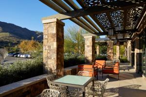 a patio with a table and chairs and awning at TownePlace Suites by Marriott Thousand Oaks Agoura Hills in Agoura Hills