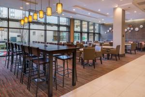 a dining room with a large table and chairs at Residence Inn by Marriott Seattle University District in Seattle