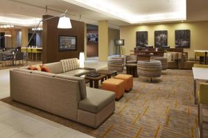 a lobby with a couch and chairs and a table at Courtyard by Marriott Sunnyvale Mountain View in Sunnyvale