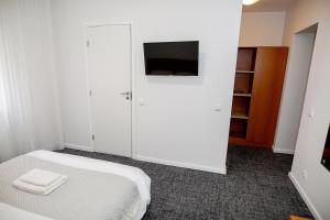 TV a/nebo společenská místnost v ubytování Hotel Tomas