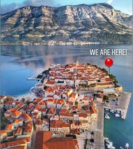 an island in the water with a red balloon at Korčula Old Town MARIJA Apartment in Korčula