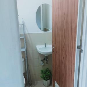 a bathroom with a sink and a mirror at Transient with bedroom near Padre Pio Church in San Felix