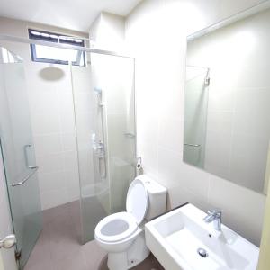 a bathroom with a toilet and a shower and a sink at Atlantis residence #2Bedroom #2-8Pax in Melaka