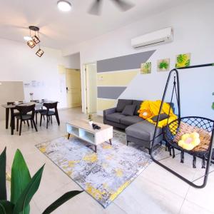 a living room with a couch and a swing at Atlantis residence #2Bedroom #2-8Pax in Melaka
