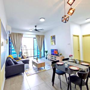 a living room with a couch and a table at Atlantis residence #2Bedroom #2-8Pax in Melaka