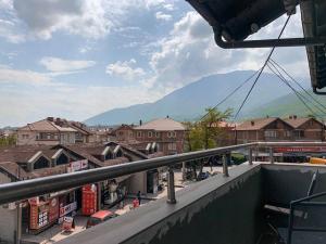 a view of a town with a mountain in the background at Cozy apartment with great views in Peje