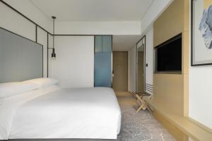Voodi või voodid majutusasutuse Four Points by Sheraton Hong Kong, Tung Chung toas