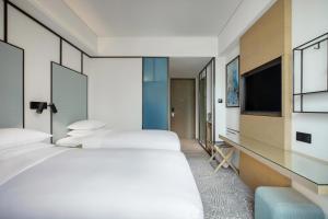 Voodi või voodid majutusasutuse Four Points by Sheraton Hong Kong, Tung Chung toas
