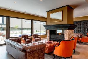 a living room with a couch and a fireplace at Auberge Du Vin, a Tribute Portfolio Hotel in Tupungato