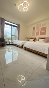 Cama o camas de una habitación en 聚一夏民宿