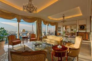 a living room filled with furniture and a large window at Sheraton Santiago Hotel & Convention Center in Santiago