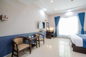 Postel nebo postele na pokoji v ubytování La Serena Hotel & Apartment