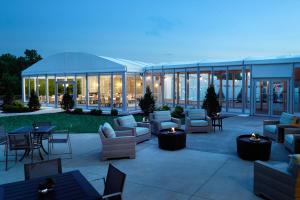 a patio with couches and tables and a building at Marriott at the University of Dayton in Dayton