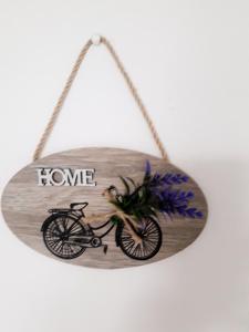 a sign that says home with a bike on it at VIEW APARTMENT in Visoko