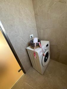 a washing machine with a basket on top of it at Sea Side Apartments & Studios-Renovated in Tsilivi