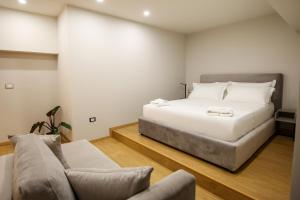 Postel nebo postele na pokoji v ubytování Toto Hotel & Apartments