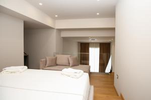 Postel nebo postele na pokoji v ubytování Toto Hotel & Apartments