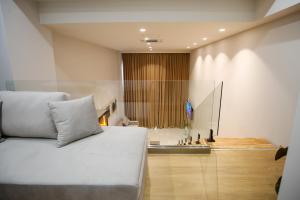Postel nebo postele na pokoji v ubytování Toto Hotel & Apartments