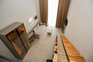 TV a/nebo společenská místnost v ubytování Toto Hotel & Apartments