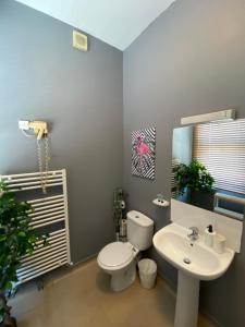 a bathroom with a white toilet and a sink at Bay view rooms at Mentone Hotel in Weston-super-Mare +117 photos