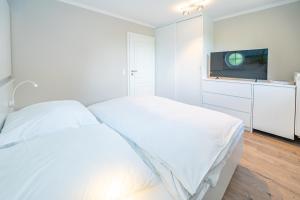Postel nebo postele na pokoji v ubytování Strandperle