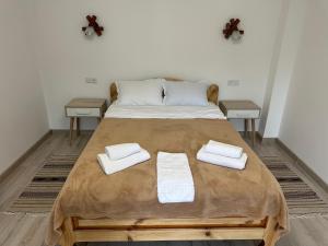 Postel nebo postele na pokoji v ubytování Zorianyy Guest House