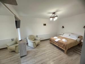 Postel nebo postele na pokoji v ubytování Zorianyy Guest House