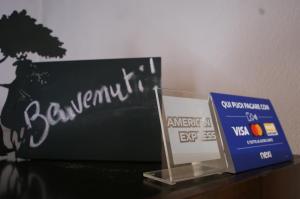 a table with a sign and a box on it at Antiche Mura in Avigliana