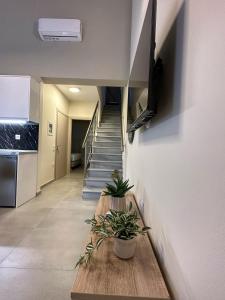 TV a/nebo společenská místnost v ubytování Bianco Mare Studios-Apartments