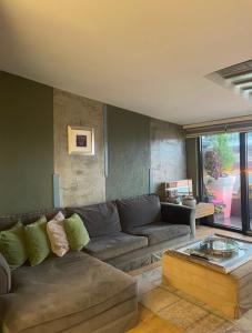 a living room with a couch and a coffee table at WILITTON BOSPHORUS HOUSE in Istanbul