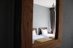 Giường trong phòng chung tại Capra Hotel Kazbegi