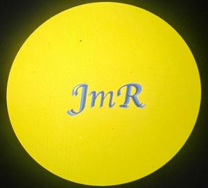 a yellow frisbee with the word timin on it at JmR Serin West studio unit pay by Gcash or cash only in Tagaytay