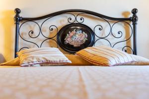 A bed or beds in a room at Agriturismo Cima alla Serra