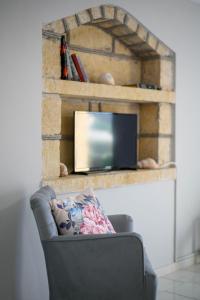 TV a/nebo společenská místnost v ubytování Κοχύλι