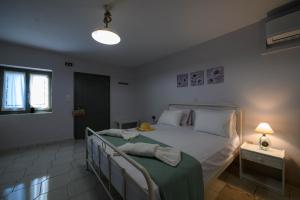 Letto o letti in una camera di Κοχύλι