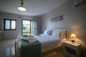 Letto o letti in una camera di Κοχύλι