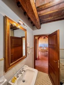 a bathroom with a sink and a mirror at Agriturismo Cima alla Serra in Buti