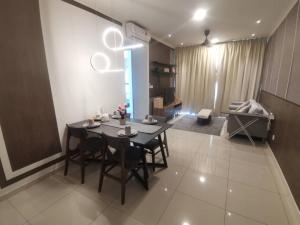 a dining room with a table and chairs in a room at Mikael Homestay Kuala Lumpur in Kuala Lumpur