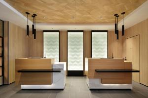 a lobby with two tables and three windows at Fairfield by Marriott Tochigi Motegi in Motegi