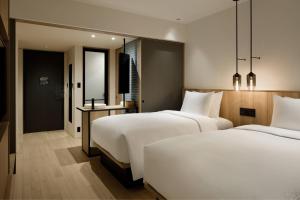 Postel nebo postele na pokoji v ubytování Fairfield by Marriott Tochigi Motegi