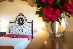 A bed or beds in a room at Agriturismo Cima alla Serra