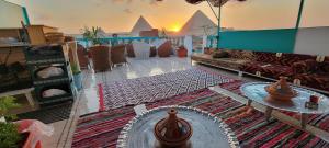 a living room with a couch and a table at Pyramids Temple Guest House in Cairo
