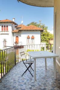 a white table and chairs on a balcony at Ca Nart in Venice-Lido