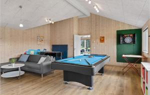 a living room with a pool table in it at Beautiful Home In lbk With Kitchen in Ålbæk