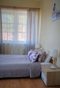 Postel nebo postele na pokoji v ubytování Laguna House
