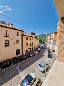a view of a street with cars parked on the road at Paolina's Home by TraMonti Apartments in LʼAquila
