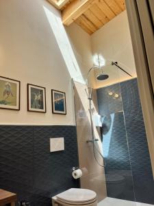 a bathroom with a shower and a toilet at B&b AlgueRoof in Alghero