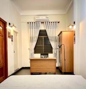 Postel nebo postele na pokoji v ubytování BÊ TÔNG RESIDENCES HOMESTAY