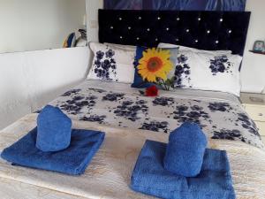 a bed with blue towels on top of it at Villa Mimosa in Moraira +19 photos
